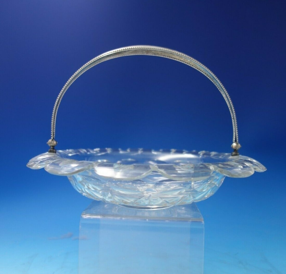 Dutch Crystal Bowl with Sterling Silver Beaded Handle 10 1/4 x 7 1/2: Dutch Crystal Bowl with Sterling Silver Beaded Handle 10 1/4 x 7 1/2 This exquisite Dutch crystal bowl features a stunning sterling silver beaded style handle, making it a beautiful addition to any co