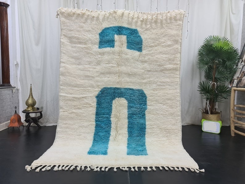 Authentic Moroccan Berber Area Rug White Blue 9.84 x 6.56 Feet: Authentic Moroccan Berber Area Rug White Blue 9.84 x 6.56 Feet Enhance your living space with this authentic White Blue Moroccan Berber Area Rug, handwoven in the Atlas Mountains by skilled local Berb