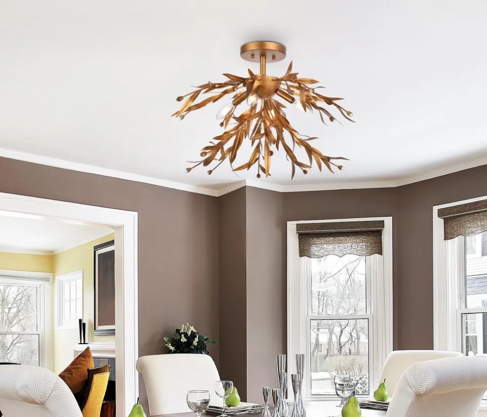 Living District 4 Light Antique Gold Leaf Semi Flush Mount Chandelier 23 Inch: Living District 4 Light Antique Gold Leaf Semi Flush Mount Chandelier 23 Inch This semi flush mount chandelier features an elegant antique gold leaf finish with four lights and clear glass accents.