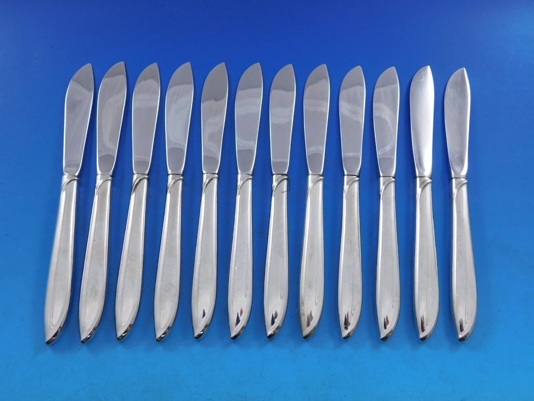 Set of 12 International Sterling Silver Silver Rhythm Butter Spread Knives 6 1/4": Set of 12 International Sterling Silver Silver Rhythm Butter Spread Knives 6 1/4" Enhance your dining experience with this exquisite set of 12 butter spreaders from the Silver Rhythm pattern by Intern