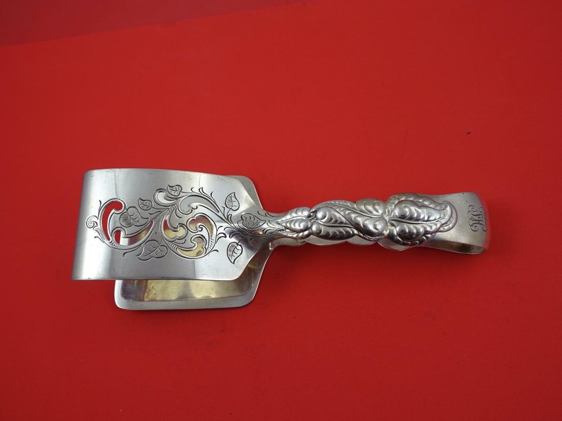 Tiffany & Co Ailanthus Sterling Silver Asparagus Tong 7 5/8": Tiffany & Co Ailanthus Sterling Silver Asparagus Tong 7 5/8" Crafted by Tiffany & Co., this exquisite asparagus tong is part of the Ailanthus pattern, showcasing a classic design that reflects the ele