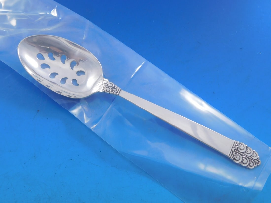 International Silver Northern Lights Sterling Silver Slotted Serving Spoon 9-Hole: International Silver Northern Lights Sterling Silver Slotted Serving Spoon 9-Hole Elevate your dining experience with this exquisite serving spoon from the Northern Lights pattern by International Sil