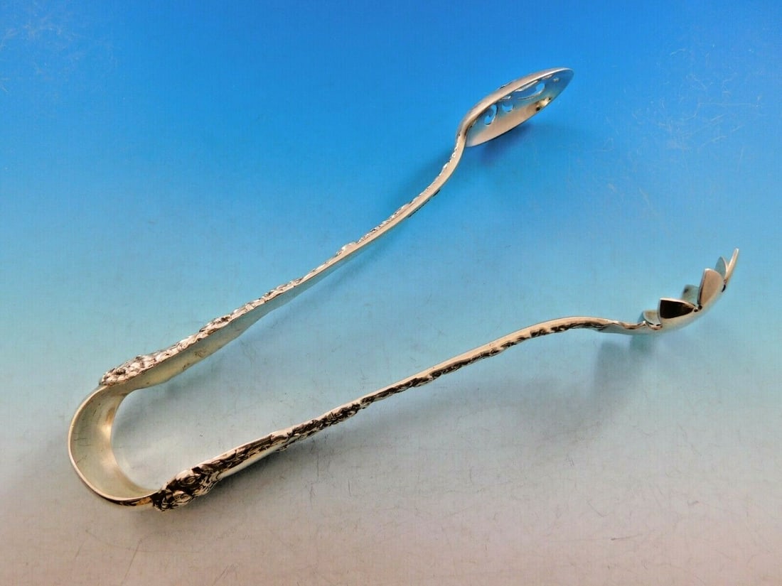 Durgin Chrysanthemum Sterling Silver Ice Tong 7 1/8 Serving Piece: Durgin Chrysanthemum Sterling Silver Ice Tong 7 1/8 Serving Piece This exquisite sterling silver ice tong is crafted by Durgin in the beloved Chrysanthemum pattern, known for its stunning floral desig