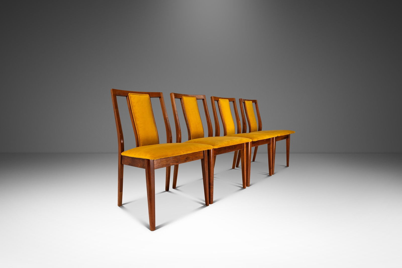 Set of Four 1960s Mid-Century Modern Walnut Dining Chairs in Yellow Felt: Set of Four 1960s Mid-Century Modern Walnut Dining Chairs in Yellow Felt This stunning set of four Mid-Century Modern dining chairs showcases exquisite craftsmanship and design from the 1960s, inspire