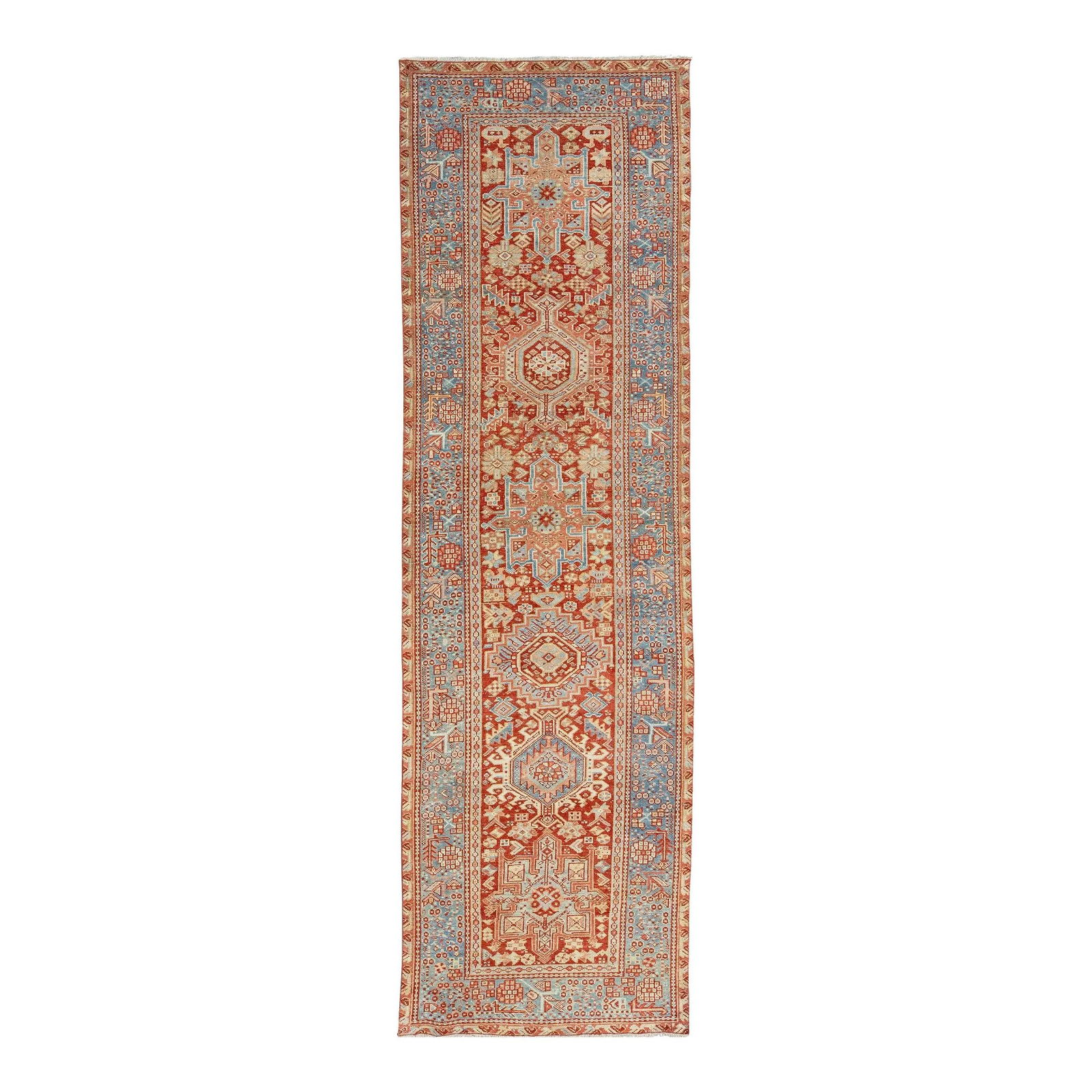 Antique Heriz Wool Runner Red Floral 3'2 x 10'9: Antique Heriz Wool Runner Red Floral 3'2 x 10'9 This exquisite 20th-century Heriz hand-knotted wool runner showcases a rich red rust field, beautifully complemented by intricate blue and beige floral