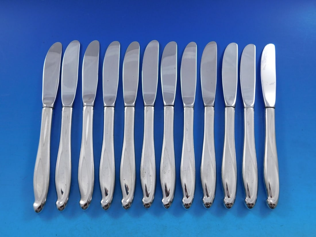 Reed & Barton Silver Sculpture Set of 12 Sterling Silver Butter Spreaders: Reed & Barton Silver Sculpture Set of 12 Sterling Silver Butter Spreaders Enhance your dining experience with this exquisite set of 12 butter spreaders from Reed & Barton, featuring the elegant Silver
