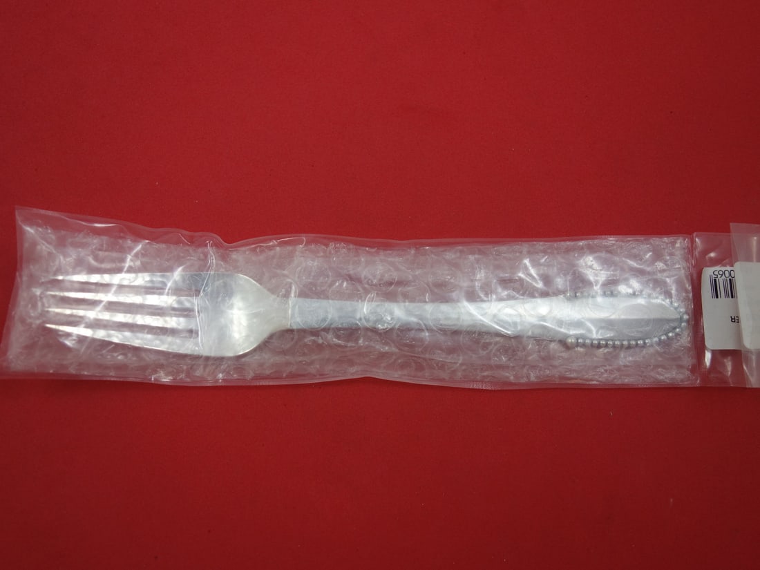 Georg Jensen Beaded Sterling Silver Dinner Fork 7 1/8 Inch New: Georg Jensen Beaded Sterling Silver Dinner Fork 7 1/8 Inch New Experience timeless elegance with this sterling silver dinner fork from the renowned Beaded pattern by Georg Jensen. Measuring 7 1/8 inch