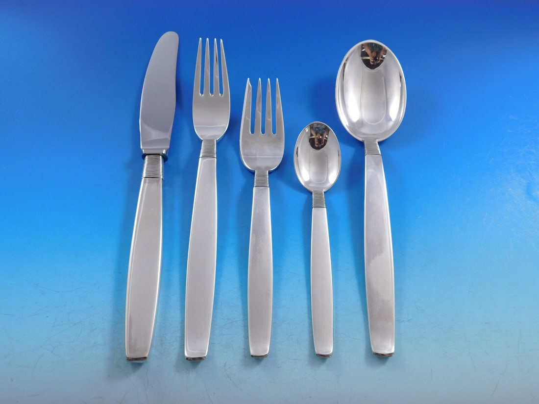 Hingelberg Silver Thread Danish Sterling Silver Flatware Set 63 pcs: Hingelberg Silver Thread Danish Sterling Silver Flatware Set 63 pcs Enhance your dining experience with this exquisite Danish Sterling Silver Flatware Set by Hingelberg, featuring a charming Silver Th