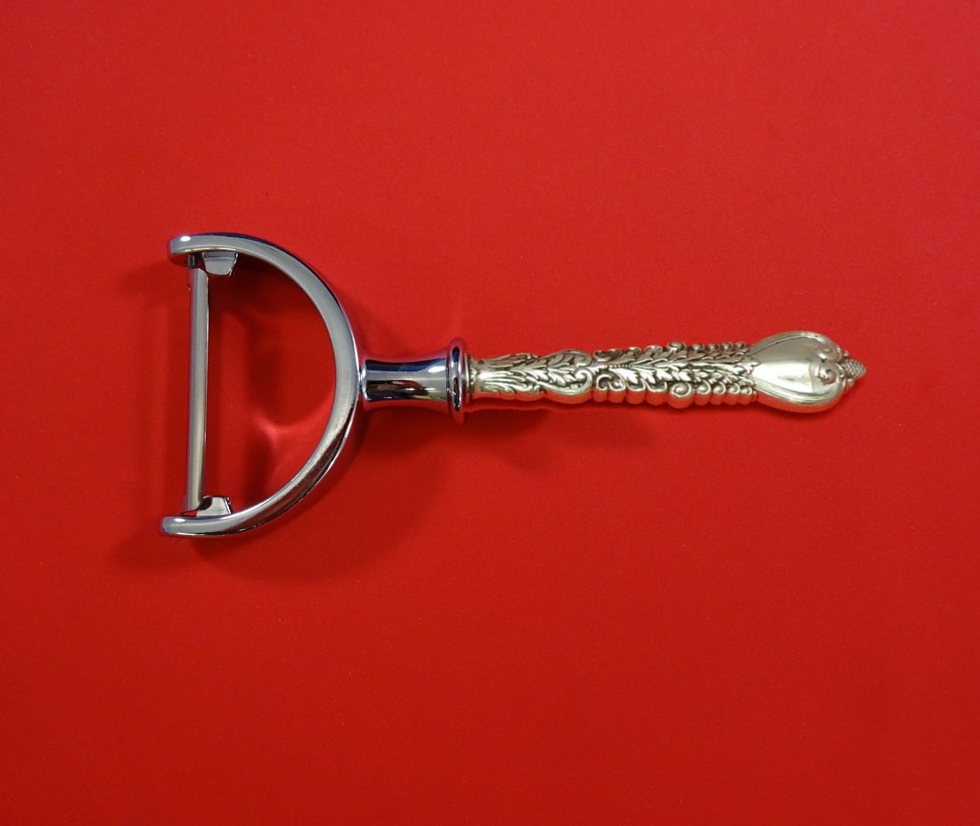 Tiffany & Co. Florentine Sterling Silver Custom Vegetable Peeler 6": Tiffany & Co. Florentine Sterling Silver Custom Vegetable Peeler 6" Experience the elegance of the Florentine pattern by Tiffany & Co. with this exquisite sterling silver vegetable peeler. Custom made