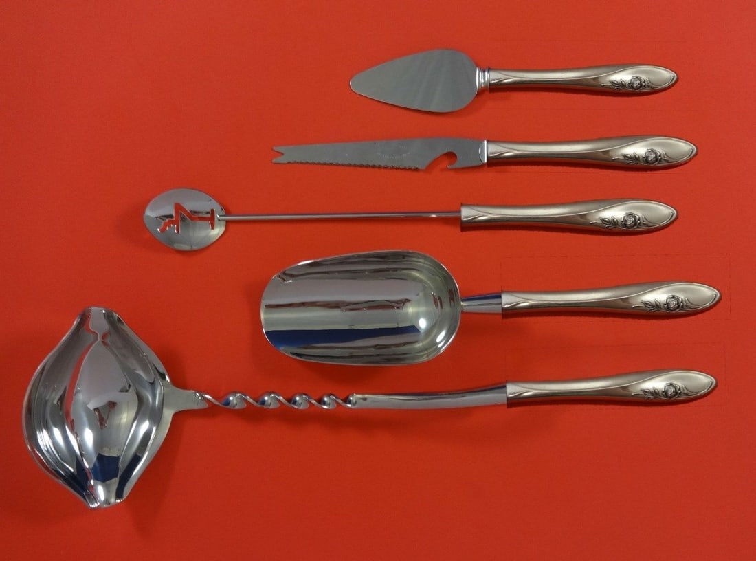 Towle Sculptured Rose Sterling Silver 5pc Cocktail Bar Set: Towle Sculptured Rose Sterling Silver 5pc Cocktail Bar Set Elevate your cocktail parties with the exquisite Sculptured Rose bar set by Towle. Crafted from sterling silver, this custom-made 5-piece hos