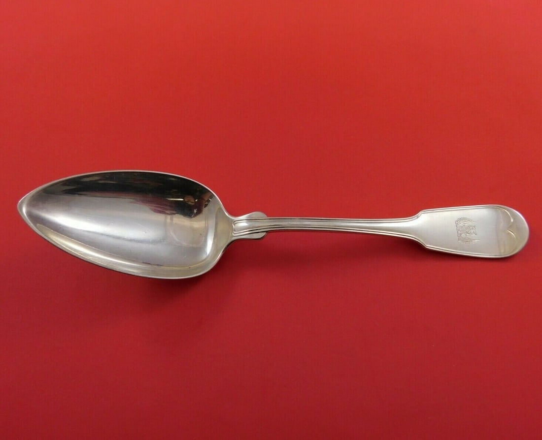 Tiffany & Co Fiddle Sterling Silver Dinner Spoon with Crest 8 3/8": Tiffany & Co Fiddle Sterling Silver Dinner Spoon with Crest 8 3/8" This exquisite dinner spoon from Tiffany & Co. showcases the classic Fiddle pattern, crafted in high-quality sterling silver. Measuri