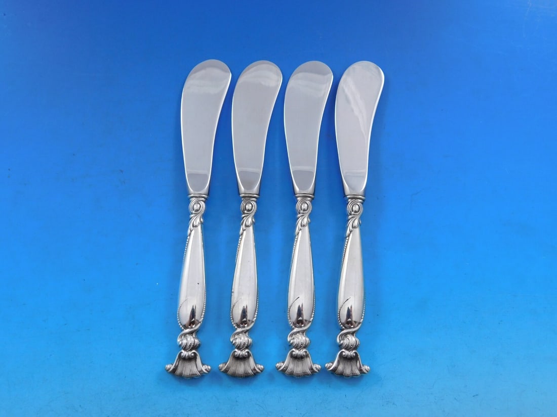 Wallace Romance of the Sea Sterling Silver Butter Spreader Set of 4: Wallace Romance of the Sea Sterling Silver Butter Spreader Set of 4 Enhance your dining experience with this exquisite set of 4 butter spreaders from the Wallace 'Romance of the Sea' collection. Craft