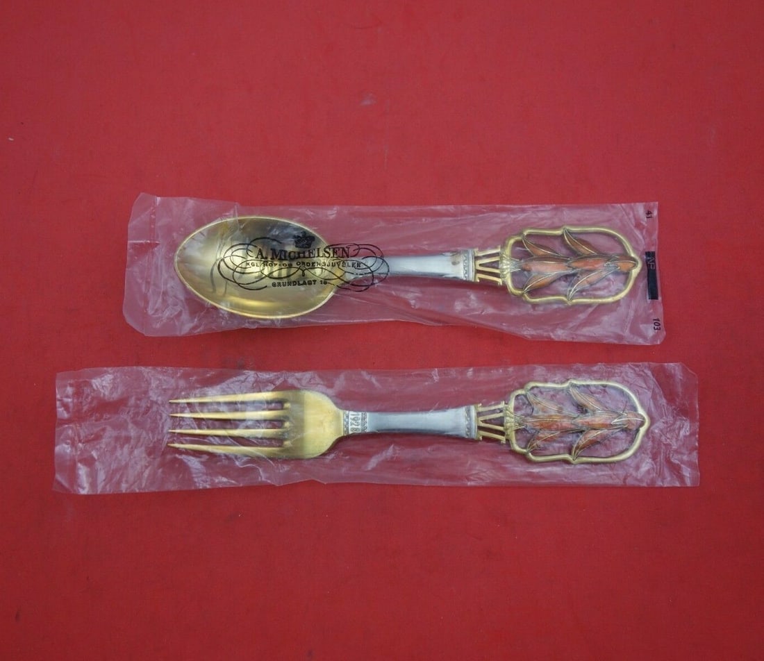 A. Michelsen 1928 Christmas Sterling Silver Fork Spoon Set 2pc Vermeil: A. Michelsen 1928 Christmas Sterling Silver Fork Spoon Set 2pc Vermeil This exquisite 2-piece fork and spoon set, crafted by A. Michelsen, showcases the elegant "Christmas" pattern designed by Thorkil