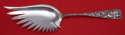 Durgin Sterling Silver Scroll Macaroni Server 10 5/8 Inches: Durgin Sterling Silver Scroll Macaroni Server 10 5/8 Inches This exquisite Macaroni Server is crafted from high-quality sterling silver and features the elegant Scroll pattern by Durgin. Measuring 10
