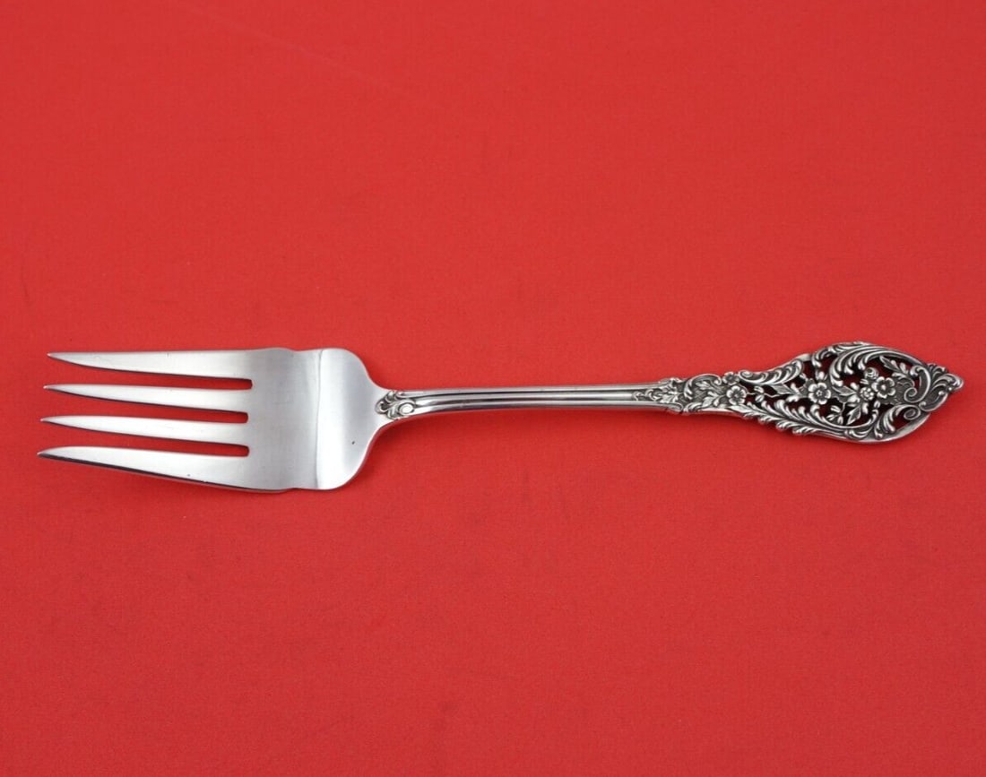 Dominick & Haff Trianon Pierced Sterling Silver Fish Fork 7.25": Dominick & Haff Trianon Pierced Sterling Silver Fish Fork 7.25" This exquisite fish fork is crafted in sterling silver (.925) and features the elegant Trianon Pierced pattern by Dominick & Haff. Measu