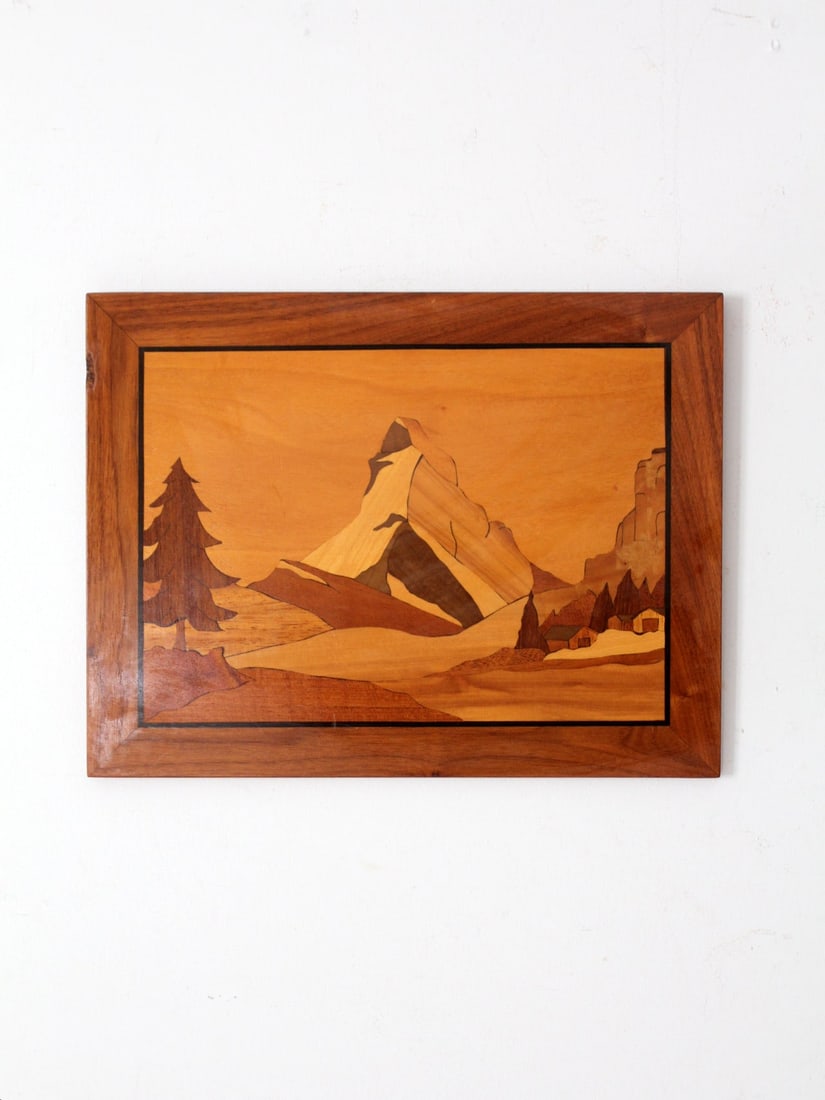 Vintage Walter Kraft Marquetry Wall Art Matterhorn Scene: Vintage Walter Kraft Marquetry Wall Art Matterhorn Scene This vintage hand-crafted marquetry wall hanging, created by Walter Kraft, showcases a breathtaking Matterhorn scene. The piece features rich w