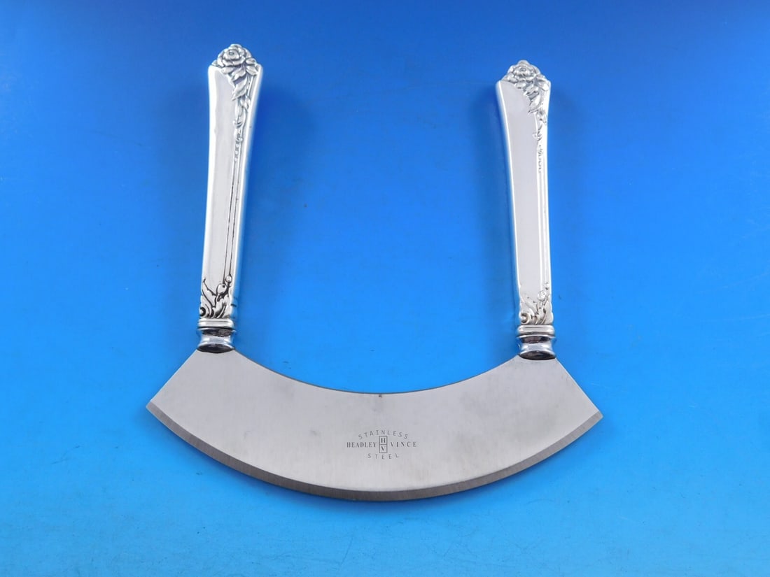 Oneida Damask Rose Sterling Silver Mezzaluna Knife 6 Inch Custom Made: Oneida Damask Rose Sterling Silver Mezzaluna Knife 6 Inch Custom Made Introducing the Damask Rose Mezzaluna Knife, a stunning custom-made piece by Oneida. This sterling silver knife features elegantly