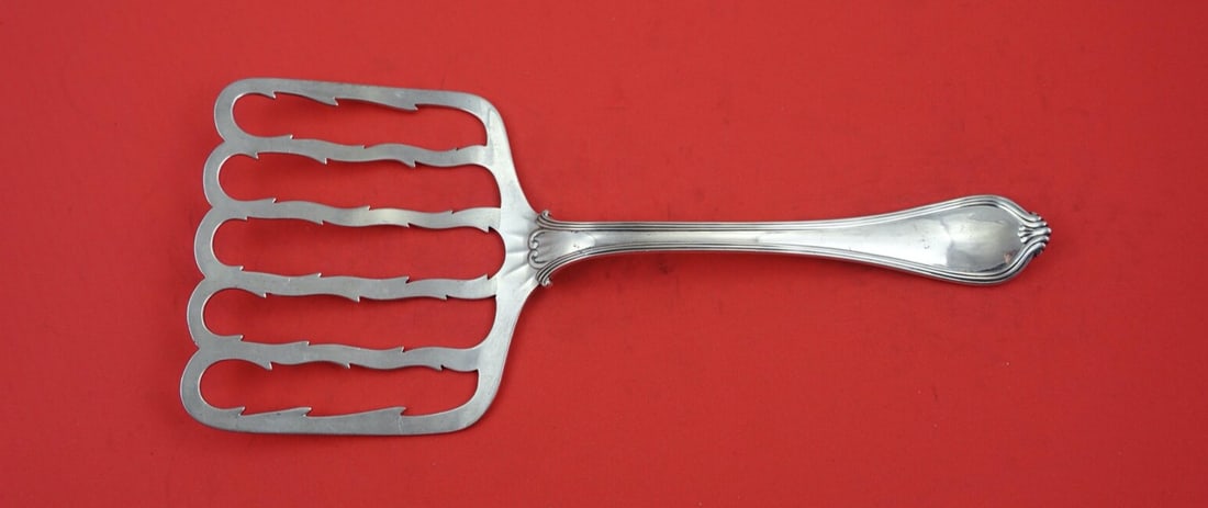 Towle Paul Revere Sterling Silver 9 Inch Toast Server: Towle Paul Revere Sterling Silver 9 Inch Toast Server This exquisite 9" toast server is crafted from sterling silver and features the elegant Paul Revere pattern by Towle. Manufactured between 1900 an