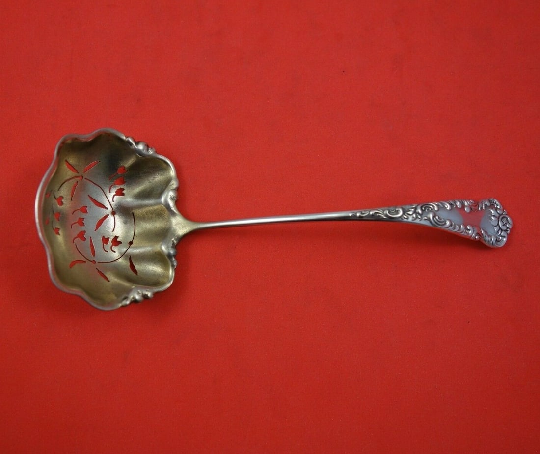 Knowles Argo Sterling Silver Pierced Sugar Sifter Ladle Gold Wash 6 1/8": Knowles Argo Sterling Silver Pierced Sugar Sifter Ladle Gold Wash 6 1/8" This exquisite sugar sifter ladle from the Argo pattern by Knowles is crafted from high-quality sterling silver. Measuring 6 1/