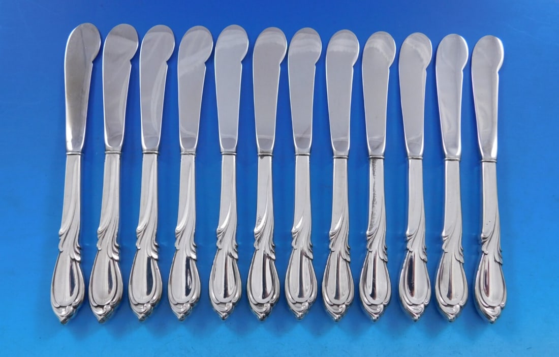 Set of 12 Rhapsody New Sterling Silver Butter Spreaders by International Silver: Set of 12 Rhapsody New Sterling Silver Butter Spreaders by International Silver This exquisite set features 12 butter spreaders crafted in the elegant Rhapsody New pattern by International Silver. Eac