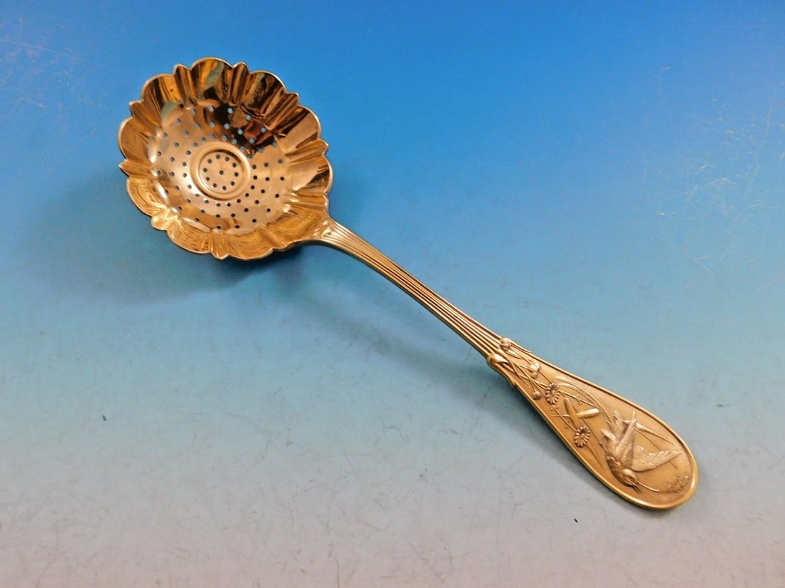 Tiffany & Co Japanese Pattern Sterling Silver Vermeil Sugar Sifter 6 7/8": Tiffany & Co Japanese Pattern Sterling Silver Vermeil Sugar Sifter 6 7/8" This exquisite sugar sifter from Tiffany & Co. showcases the elegant 'Japanese' pattern, designed in 1871 during a pivotal era