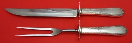 International Sterling Silver Pine Tree 2pc Roast Carving Set: International Sterling Silver Pine Tree 2pc Roast Carving Set Enhance your dining experience with this exquisite Pine Tree Roast Carving Set. Crafted by International, this two-piece set features a st