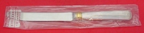 Reed and Barton Ashmont Gold Sterling Silver Dinner Knife 9 7/8": Reed and Barton Ashmont Gold Sterling Silver Dinner Knife 9 7/8" Enhance your dining experience with the Ashmont Gold dinner knife by Reed and Barton. This exquisite piece is crafted from sterling sil