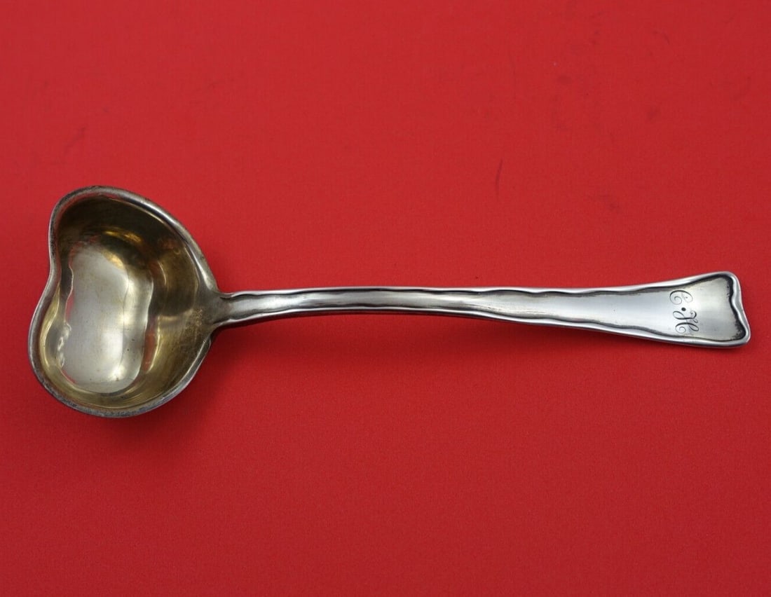 Tiffany & Co 8 Inch Sterling Silver Heart Shaped Gravy Ladle: Tiffany & Co 8 Inch Sterling Silver Heart Shaped Gravy Ladle This exquisite gravy ladle from Tiffany & Co. features the elegant Lap Over Edge Plain pattern. Crafted from high-quality sterling silver (
