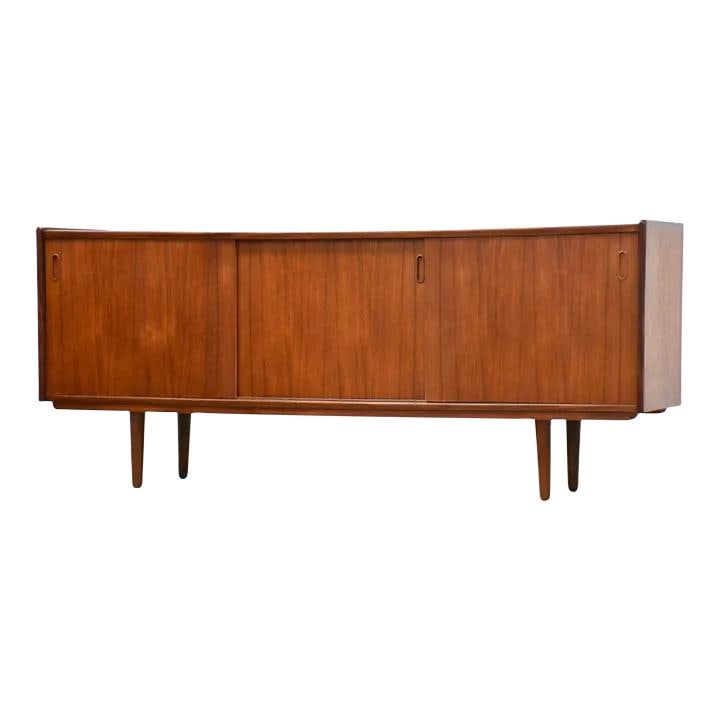 Mid Century Danish Teak Sliding Door Sideboard Credenza: Mid Century Danish Teak Sliding Door Sideboard Credenza This stunning mid-century modern teak sideboard credenza features a sleek design with three sliding doors, two adjustable shelves, and two small