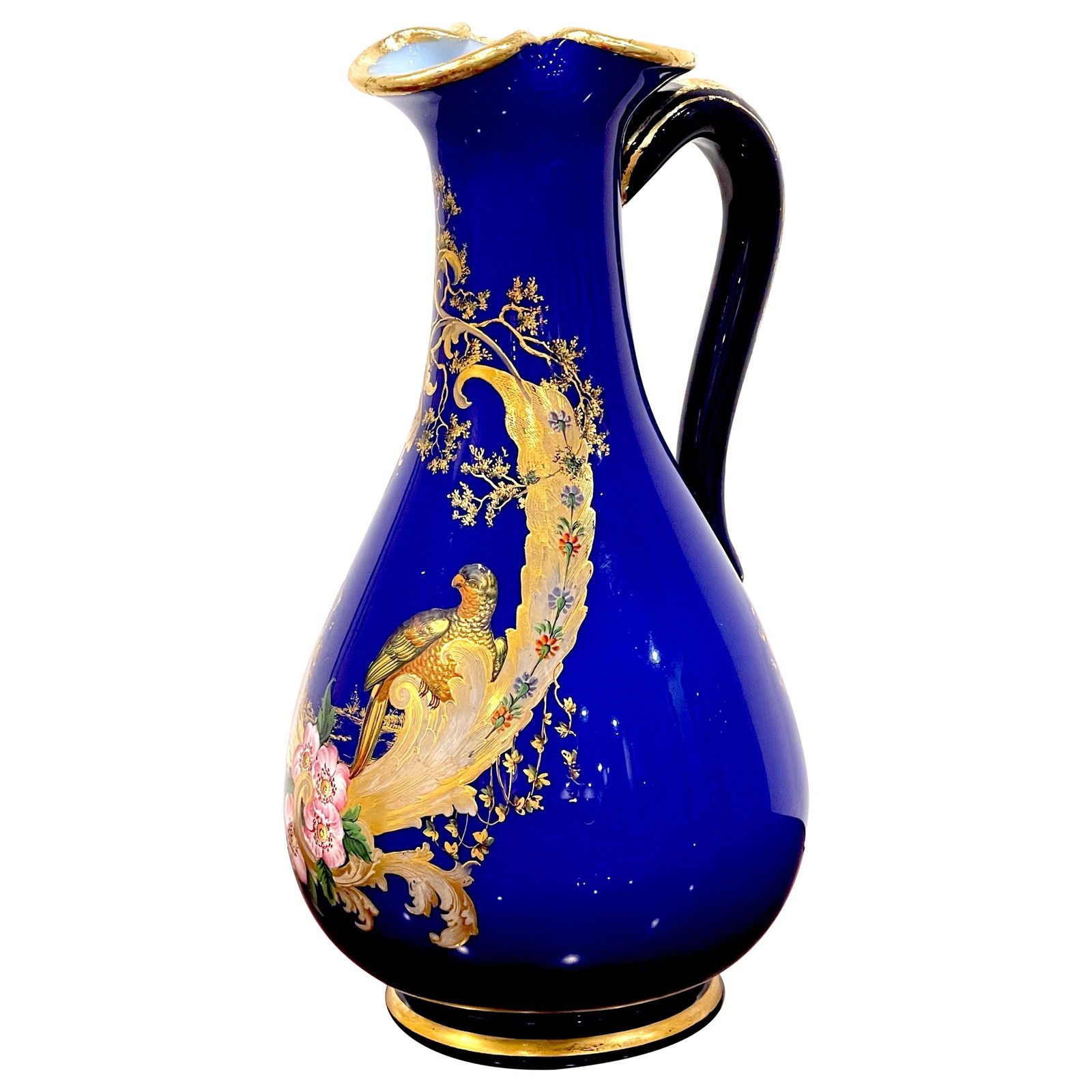19th Century French Cobalt Gilt Enameled Ewer Bird of Paradise: 19th Century French Cobalt Gilt Enameled Ewer Bird of Paradise This magnificent French cobalt gilt enameled ewer from the 1870s exemplifies exceptional craftsmanship and design. Standing 10 inches tal