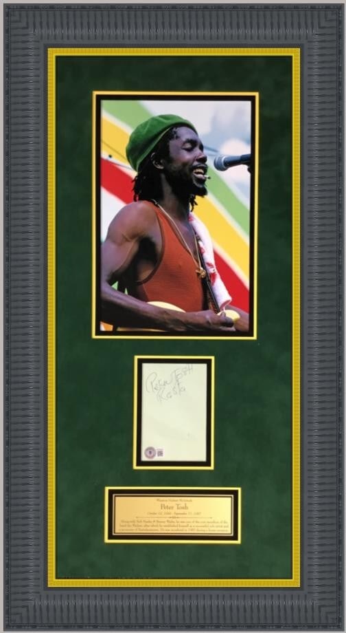 Peter Tosh Signed Photograph Custom Framed Beckett Authenticated: Peter Tosh Signed Photograph Custom Framed Beckett Authenticated This stunning custom framed photograph features a signed cut card by the legendary Peter Tosh, an iconic figure in reggae music. The fr