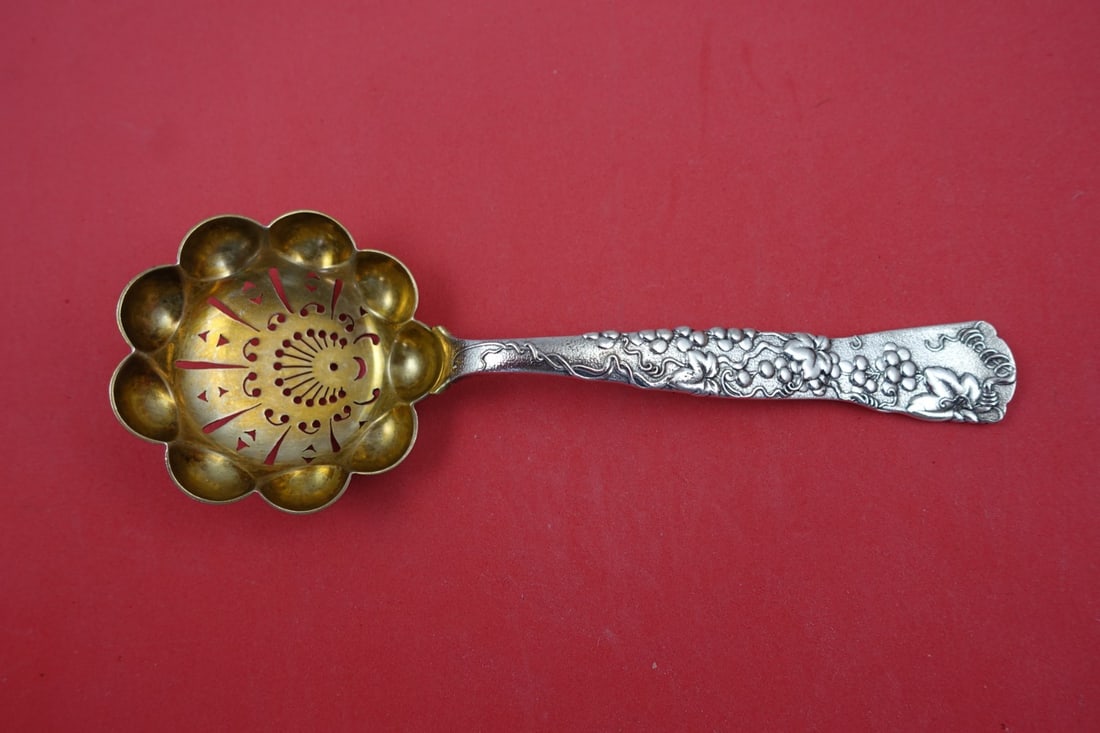 Tiffany & Co. Vine Sterling Silver Sugar Sifter Grapevine Motif 7 3/4": Tiffany & Co. Vine Sterling Silver Sugar Sifter Grapevine Motif 7 3/4" Elevate your servingware with this exquisite sugar sifter from Tiffany & Co., featuring the elegant Vine pattern. Crafted in ster