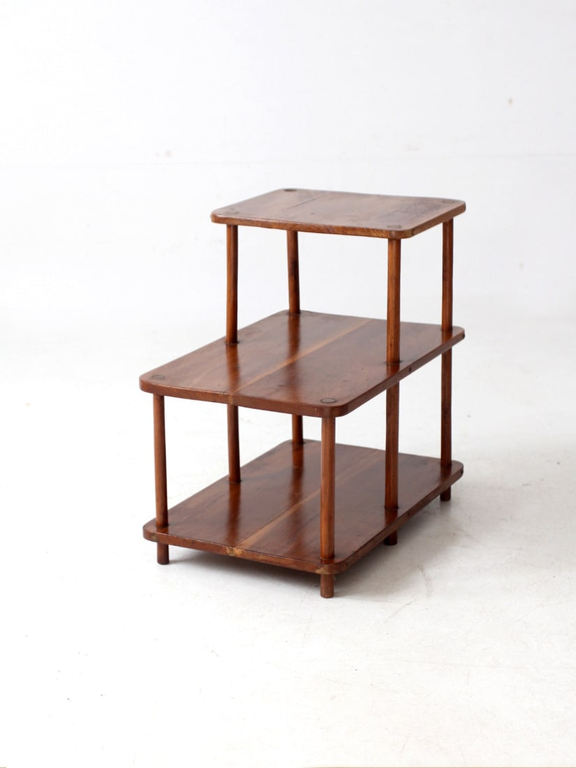 Mid-Century Modern Tiered Side Table with Three Levels: Mid-Century Modern Tiered Side Table with Three Levels This mid-century tiered side table showcases a streamlined architectural silhouette that embodies classic modern design. With its three-level str