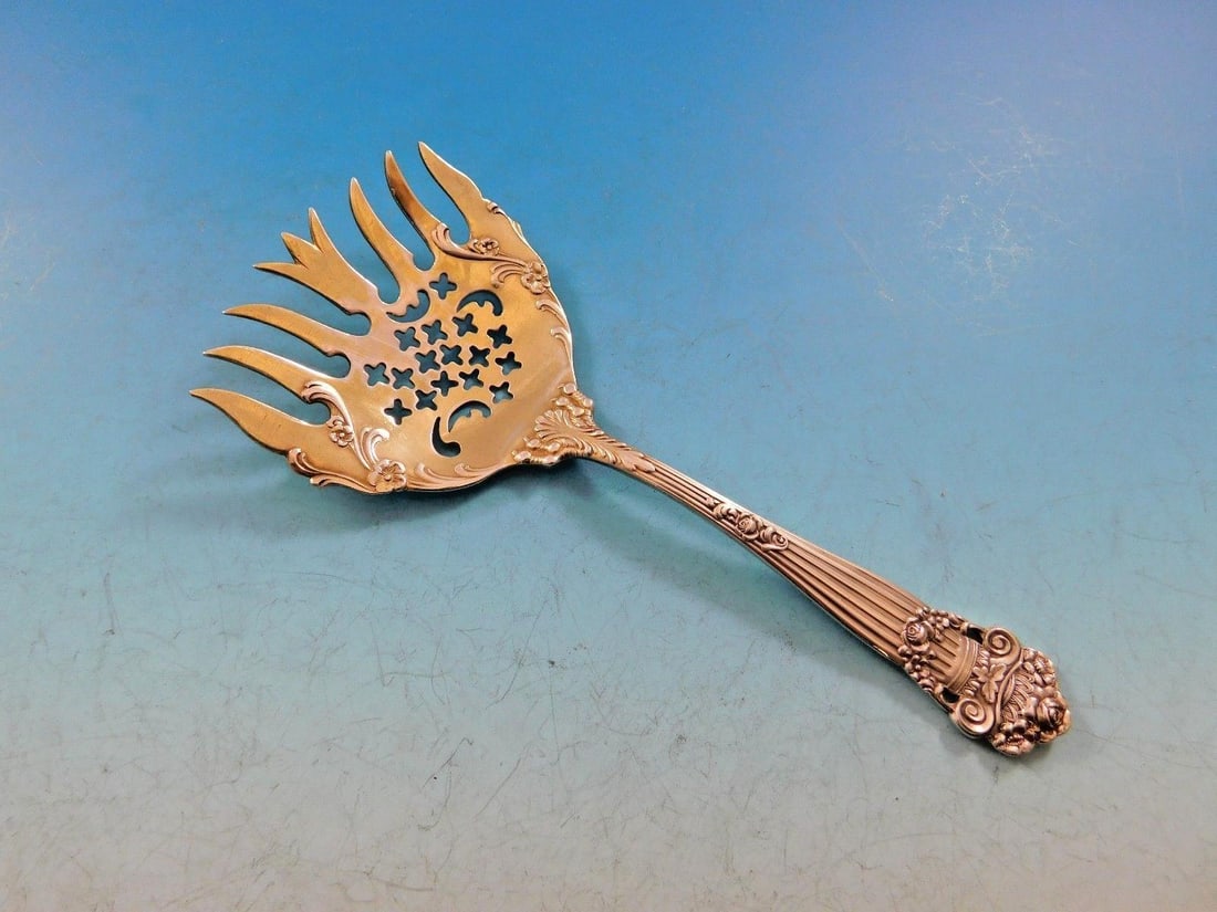 Towle Georgian Sterling Silver Sardine Fork Gold-Washed Pierced 5.5": Towle Georgian Sterling Silver Sardine Fork Gold-Washed Pierced 5.5" This exquisite sardine fork from the Georgian pattern by Towle is crafted from sterling silver and features a beautiful gold-washed