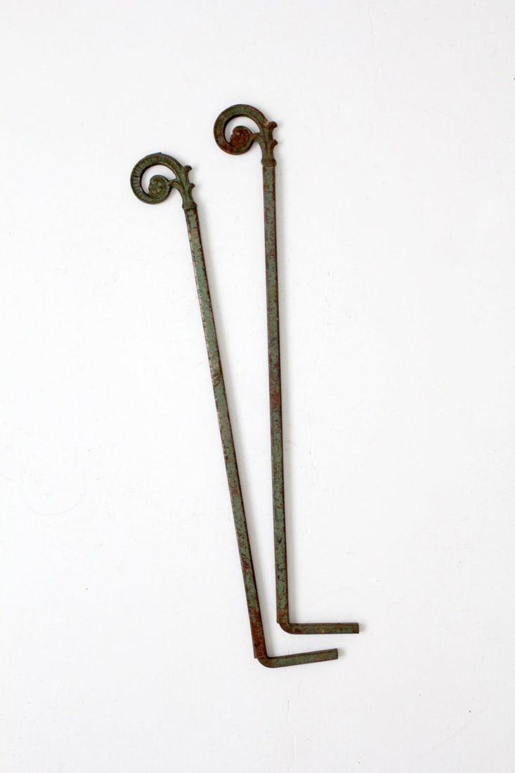 Vintage Green Antique Drapery Hanger Pair with Foliage Design: Vintage Green Antique Drapery Hanger Pair with Foliage Design This exquisite pair of antique drapery hangers showcases a beautiful decorative curled foliage pattern at the ends of the metal slide-out