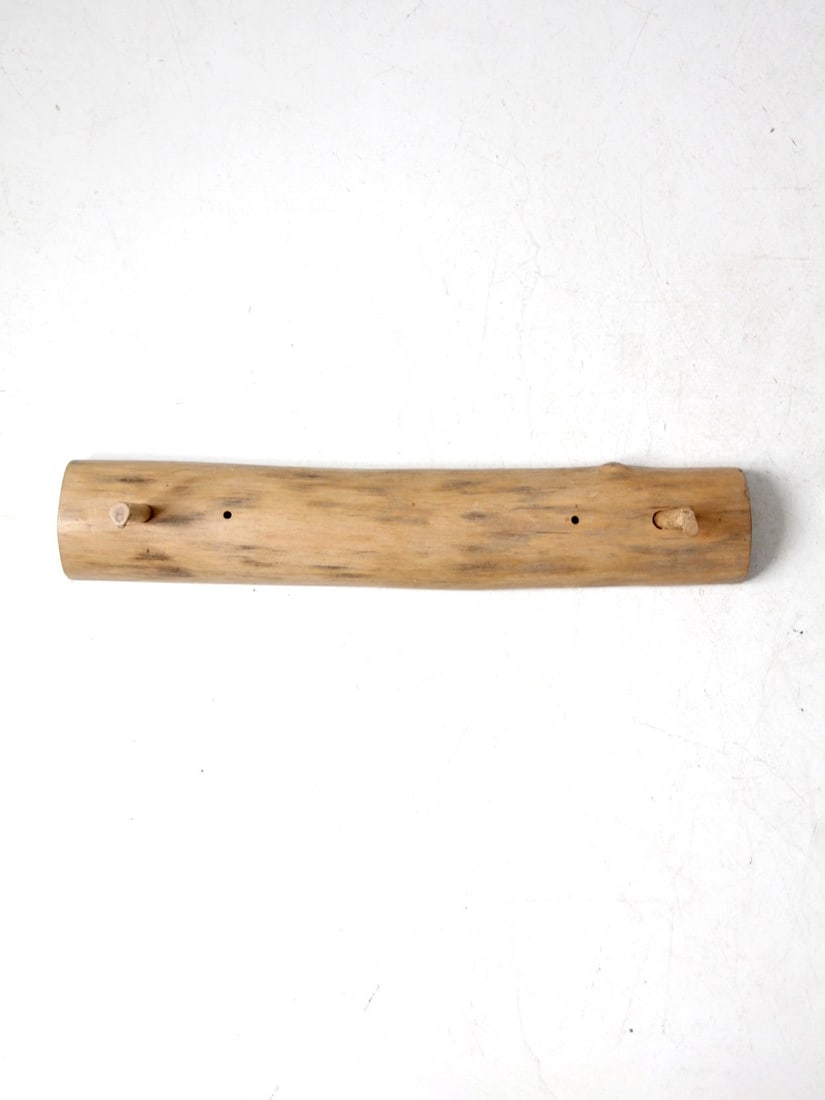 Rustic Vintage Hand-Carved Pine Wall Rack with Peg Hooks: Rustic Vintage Hand-Carved Pine Wall Rack with Peg Hooks This vintage hand-carved pine wall rack features a smooth, natural wood form with two rounded peg hooks. The design showcases the organic shape
