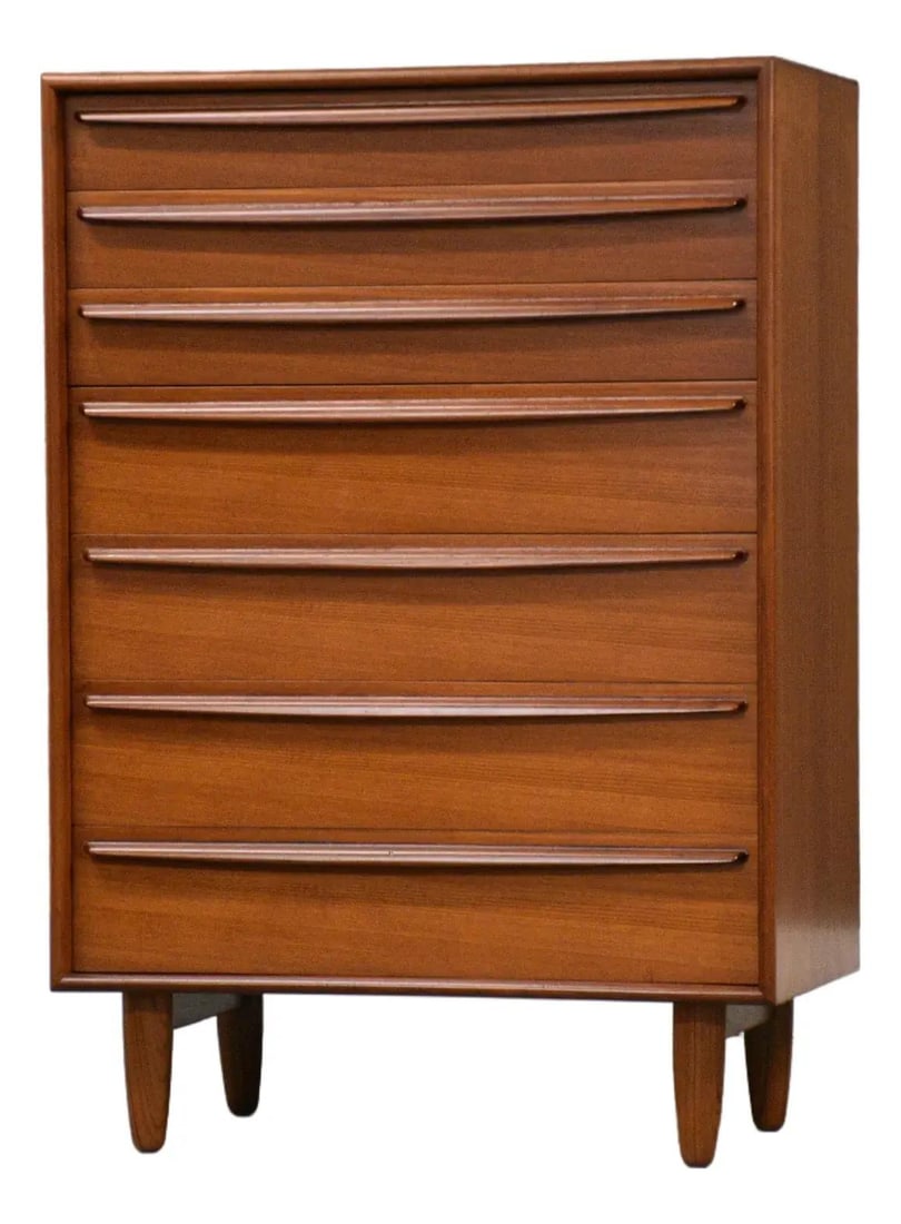 1960s Danish Modern Teak Dresser by Falaster: 1960s Danish Modern Teak Dresser by Falaster This exquisite mid-century modern tall dresser features a striking design with sculpted pulls and elegant tapered legs, attributed to the renowned designer