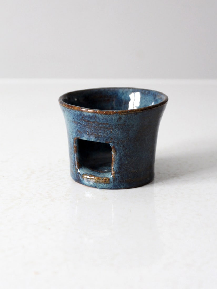 Signed Vintage Studio Pottery Tealight Candle Holder Blue Glaze: Signed Vintage Studio Pottery Tealight Candle Holder Blue Glaze This vintage studio pottery tealight candle holder showcases a stunning rich blue glaze and is signed by the artist. It features a squar