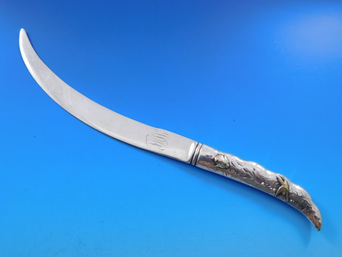 Tiffany & Co. Shiebler Sterling Silver Paper Knife with Gold Bird 10.5in: Tiffany & Co. Shiebler Sterling Silver Paper Knife with Gold Bird 10.5in This exquisite paper knife is a remarkable example of craftsmanship, featuring a sterling silver hollow handle made by the reno