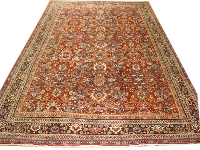 Handcrafted Antique Persian Sarouk Rug 10'6 x 17': Handcrafted Antique Persian Sarouk Rug 10'6 x 17' Free continental US Shipping This stunning antique Persian Sarouk rug is handcrafted by skilled Persian artisans, showcasing traditional designs that