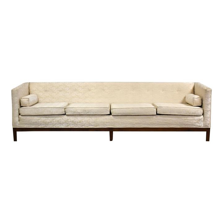 1960s Mid Century Modern Walnut Sofa with White Upholstery: 1960s Mid Century Modern Walnut Sofa with White Upholstery This stunning mid-century modern sofa features a beautifully crafted walnut base paired with elegant white upholstery. The piece has been pro