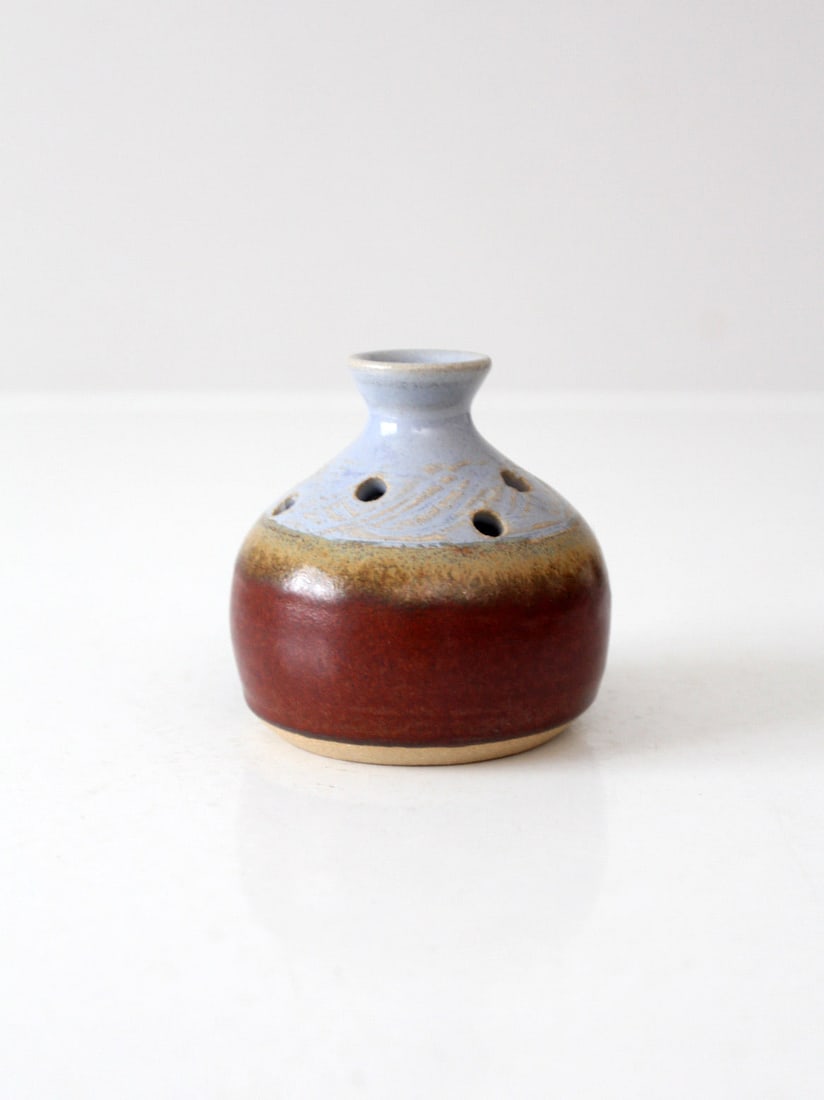 Vintage Studio Pottery Flower Frog Vase in Periwinkle Blue and Green Glaze: Vintage Studio Pottery Flower Frog Vase in Periwinkle Blue and Green Glaze This vintage studio pottery flower frog vase showcases a gently rounded shape with a narrow neck and multiple holes for stems