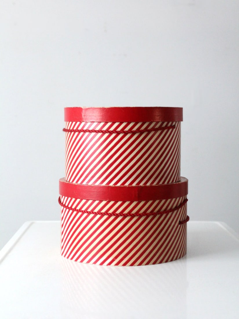 Charming Vintage Candy Cane Stripe Hat Boxes Set of 2: Charming Vintage Candy Cane Stripe Hat Boxes Set of 2 This delightful pair of vintage hat boxes features a charming red and white "candy cane" striped design, perfect for adding a festive touch to you