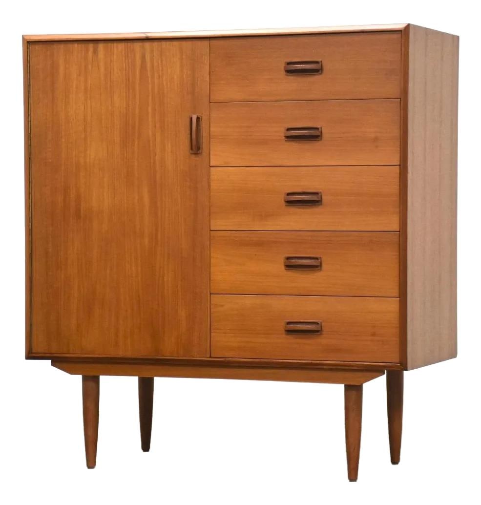 1960s Danish Modern Teak Armoire Dresser with Ample Storage: 1960s Danish Modern Teak Armoire Dresser with Ample Storage This 1960s Danish Modern teak armoire dresser showcases a sleek mid-century design, featuring a door that opens to reveal ample shelving and