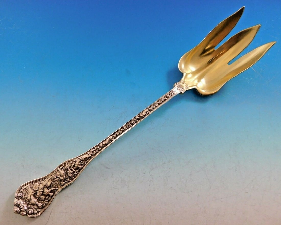 Tiffany & Co Olympian Sterling Silver Salad Fork 10.5 Inch Gold-Washed: Tiffany & Co Olympian Sterling Silver Salad Fork 10.5 Inch Gold-Washed This exquisite salad serving fork from the Olympian pattern by Tiffany & Co. showcases the artistry and craftsmanship of sterling