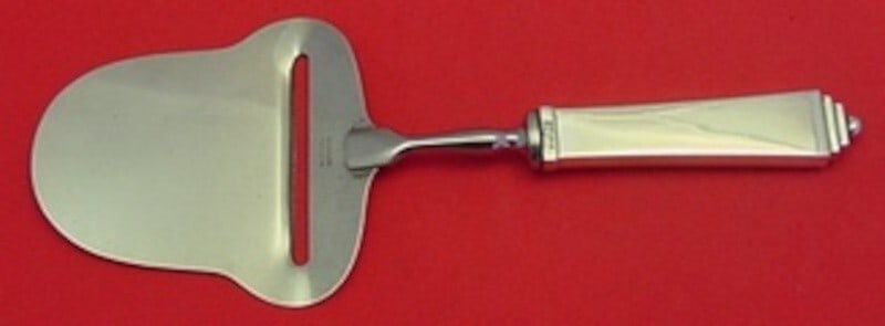 Georg Jensen Pyramid Sterling Silver Cheese Plane 8 inch: Georg Jensen Pyramid Sterling Silver Cheese Plane 8 inch Elevate your cheese serving experience with the Pyramid cheese plane by Georg Jensen. Crafted from premium sterling silver, this piece features