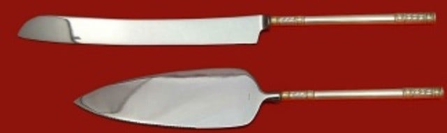 Wallace Aegean Weave Gold Sterling Silver Wedding Cake Set 2pc: Wallace Aegean Weave Gold Sterling Silver Wedding Cake Set 2pc This exquisite Aegean Weave Gold wedding cake set by Wallace is crafted from high-quality sterling silver and features a beautiful gold a