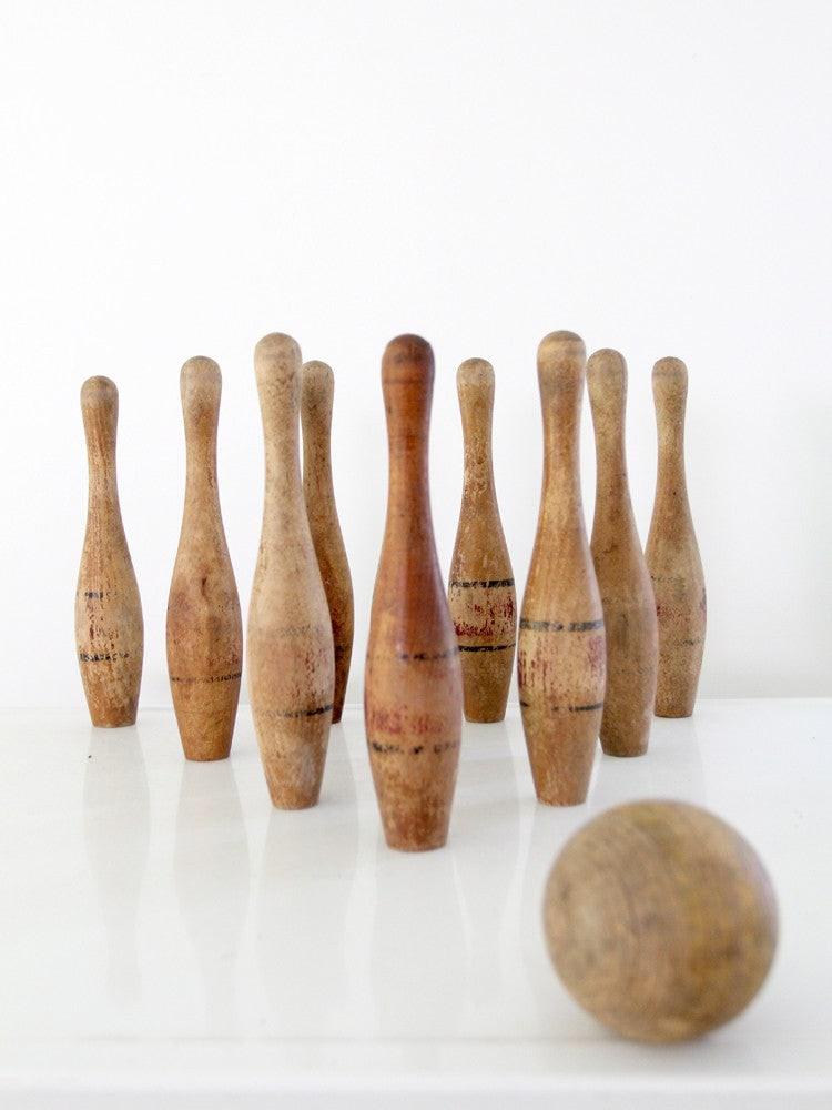 Vintage Antique Wooden Skittle Bowling Game Set with Box: Vintage Antique Wooden Skittle Bowling Game Set with Box Discover a charming antique skittle set that brings nostalgia to any game night. This delightful wooden bowling game includes 10 pins adorned w
