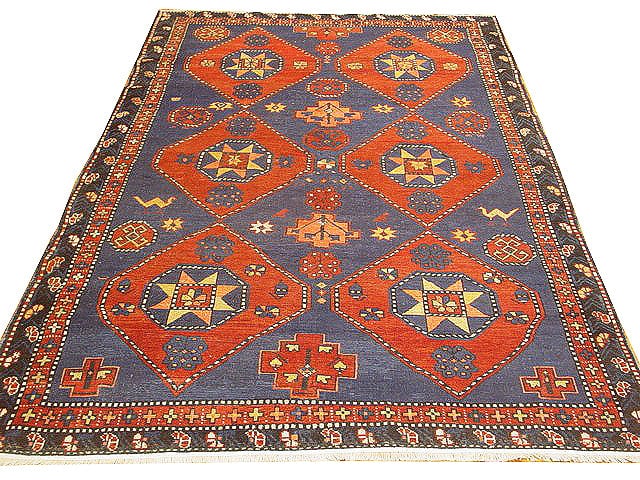 5 x 7.3 Blue Antique Russian Kazak Hand-Knotted Wool Rug: 5 x 7.3 Blue Antique Russian Kazak Hand-Knotted Wool Rug Free continental US Shipping Enhance your living space with this exquisite 5' x 7' Blue Antique Russian Kazak Rug. A beautiful representation o