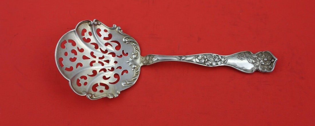 Blackinton Cherry Blossom Sterling Silver Tomato Server 7.5": Blackinton Cherry Blossom Sterling Silver Tomato Server 7.5" This exquisite tomato server features the elegant Cherry Blossom pattern by Blackinton, crafted from high-quality sterling silver. With a l